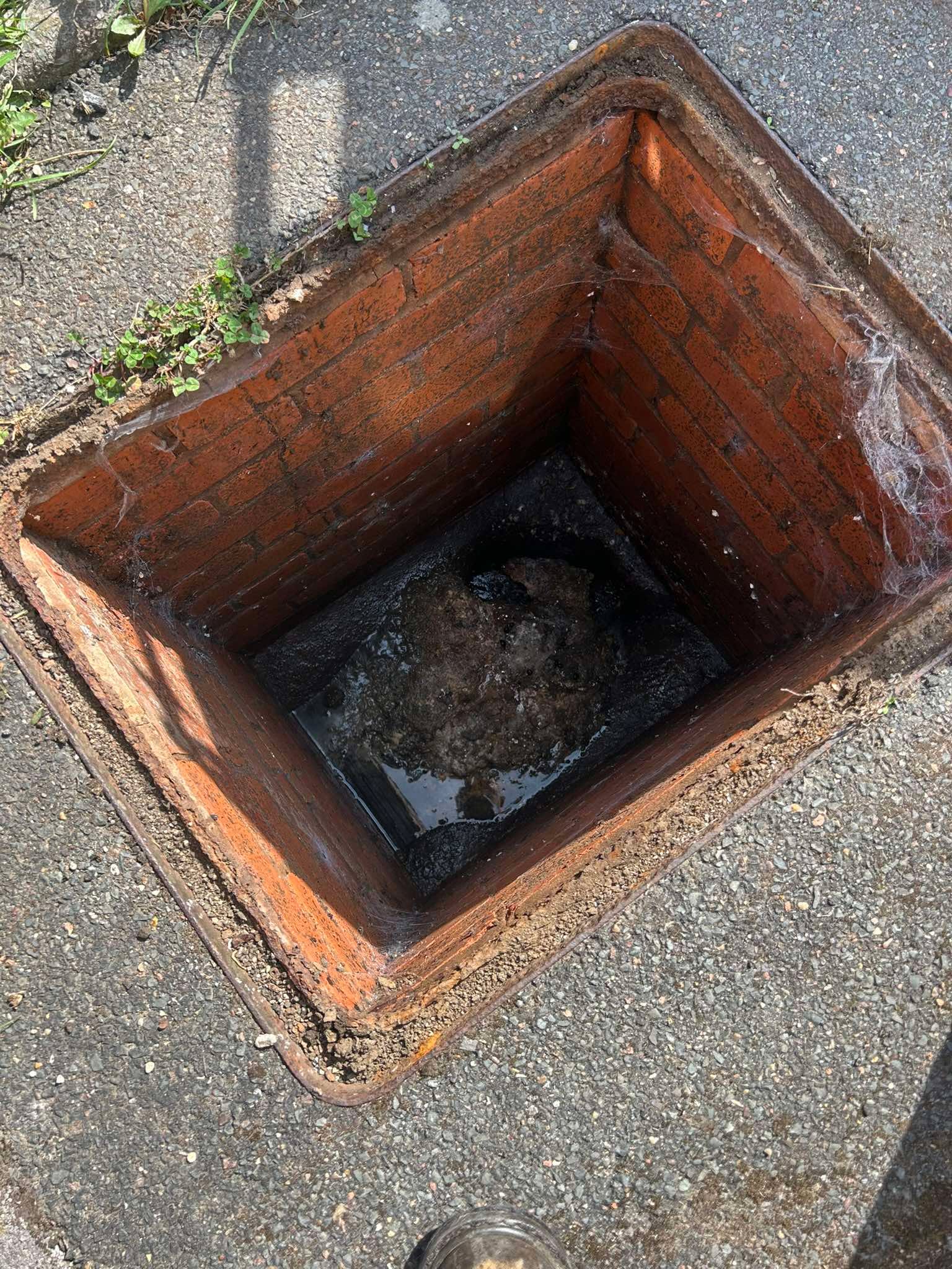 Blocked drainage chamber before clearing by Top Gun & Son